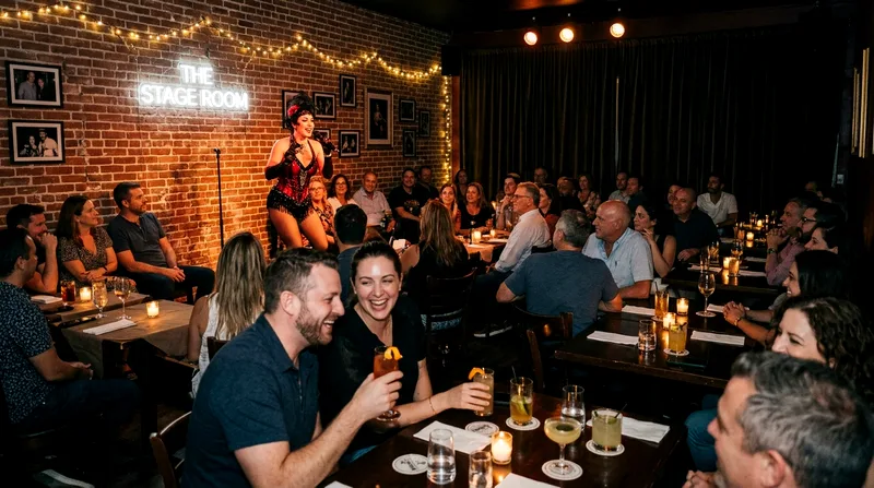 Intimate Wynwood evening cabaret with small audience seated at close tables around performer.