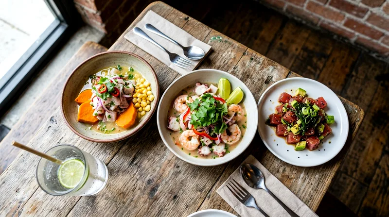 Overhead shot of three ceviche and seafood bowls on wooden table in Wynwood restaurant.
