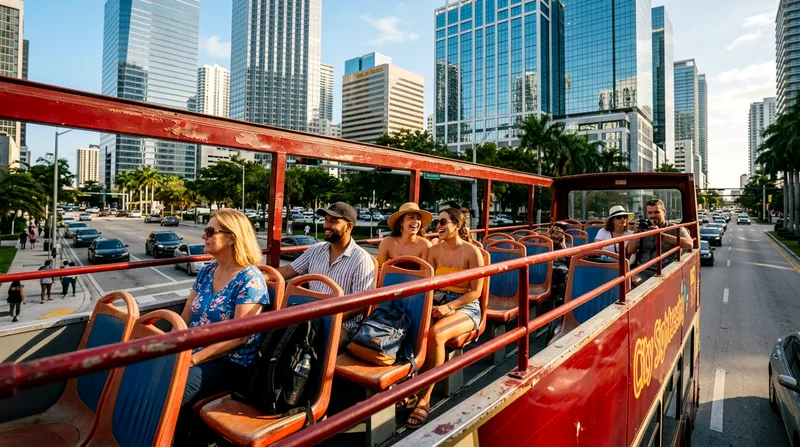 Passengers seated on an open-air double-decker bus with Miami's downtown skyline visible