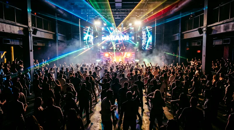 Crowded nightclub dance floor with DJ booth, laser lights, and dancing silhouettes.